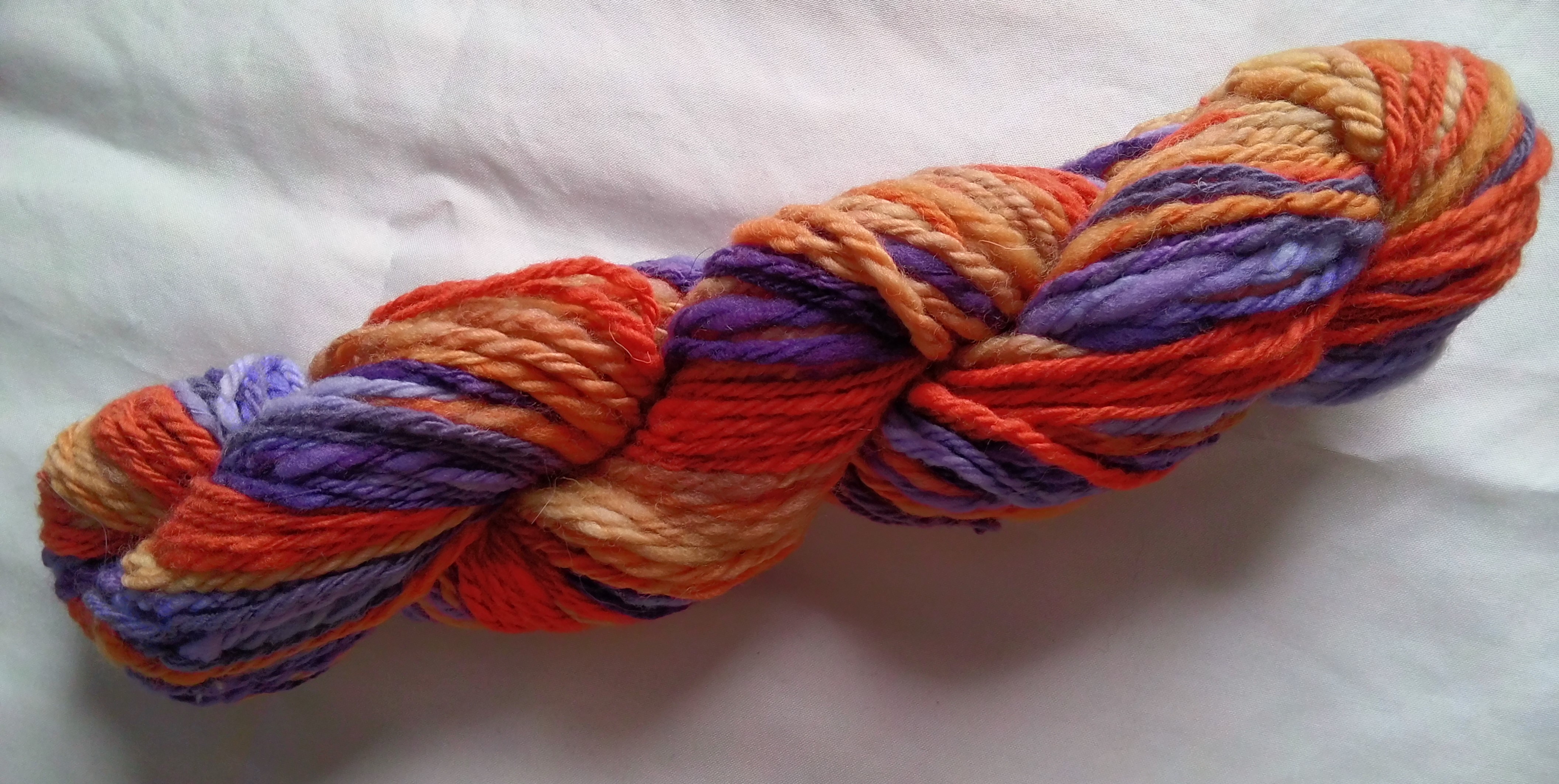 orange and red handspun yarn skein